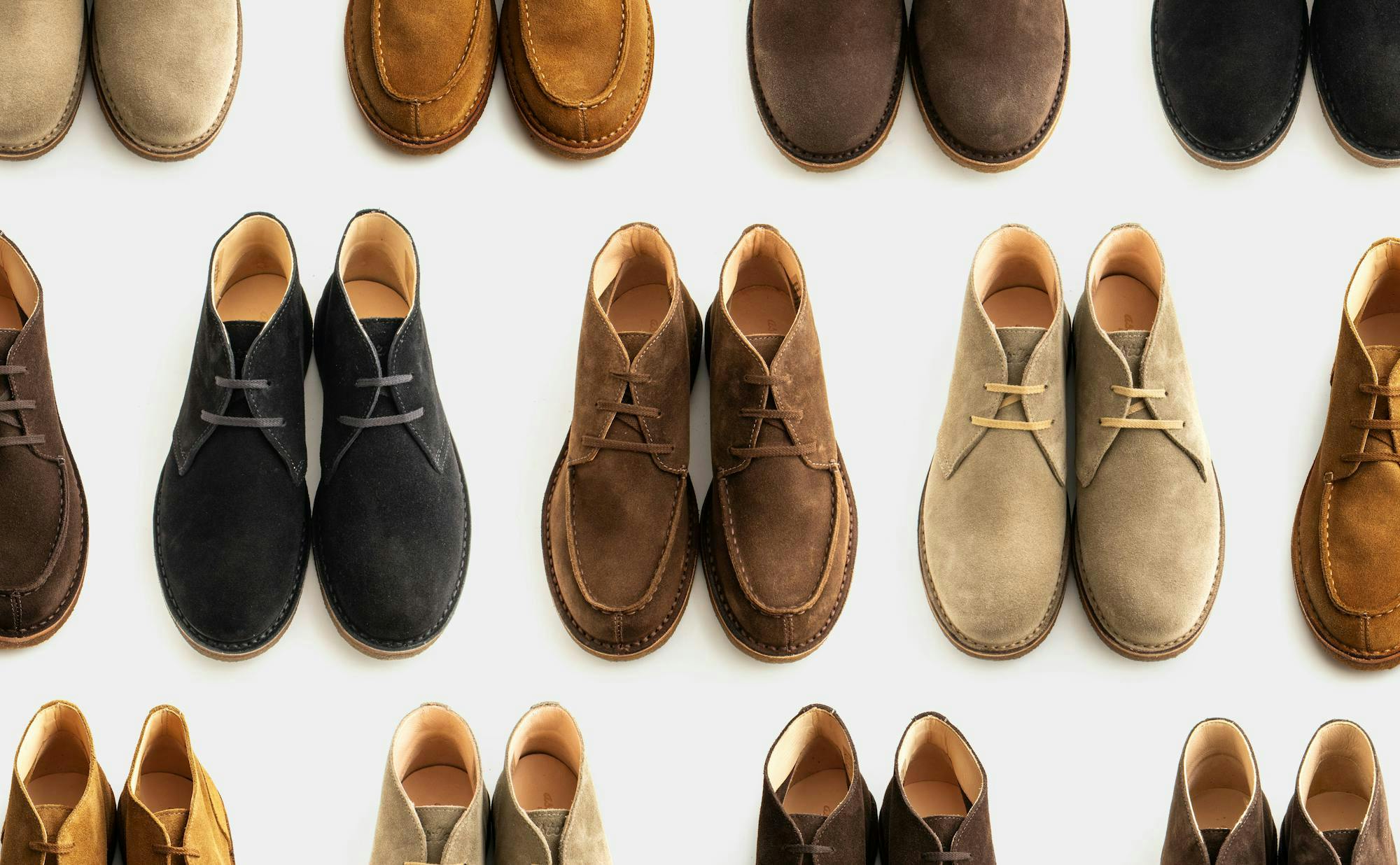 Thirteen pairs of Astorflex chukka boots in different suedes.