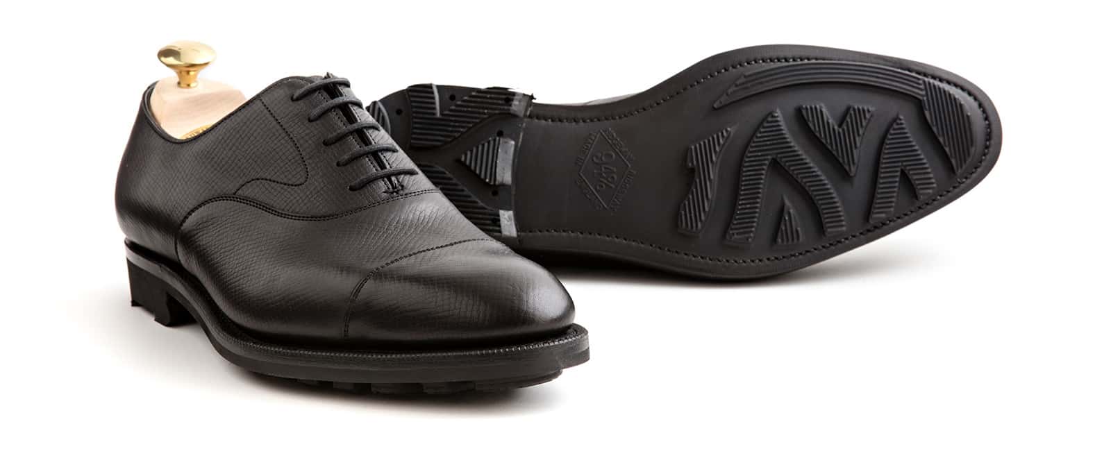 Edward Green Chelsea in black Utah calfskin view with one sole visible.