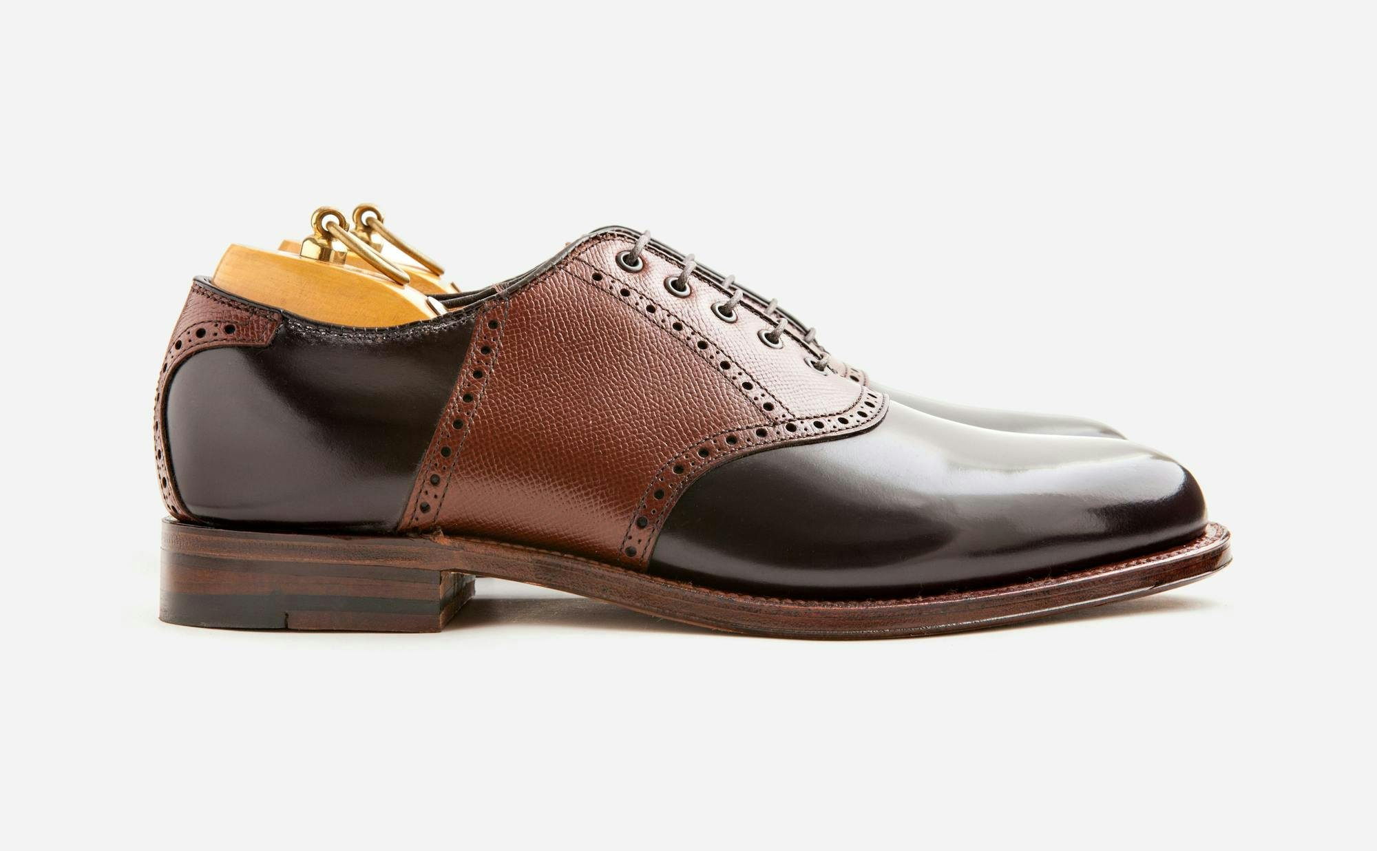 Side view of an Alden x Leffot saddle shoe in color 8 shell cordovan and brown alpine grain calfskin.