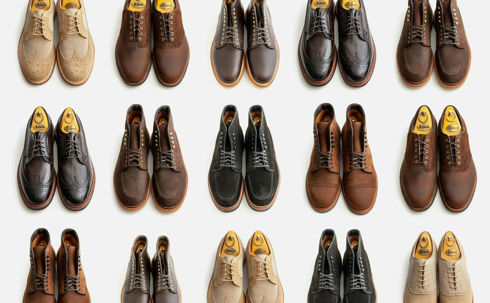 Fifteen Alden boots and shoes arranged in a grid on a light grey background.