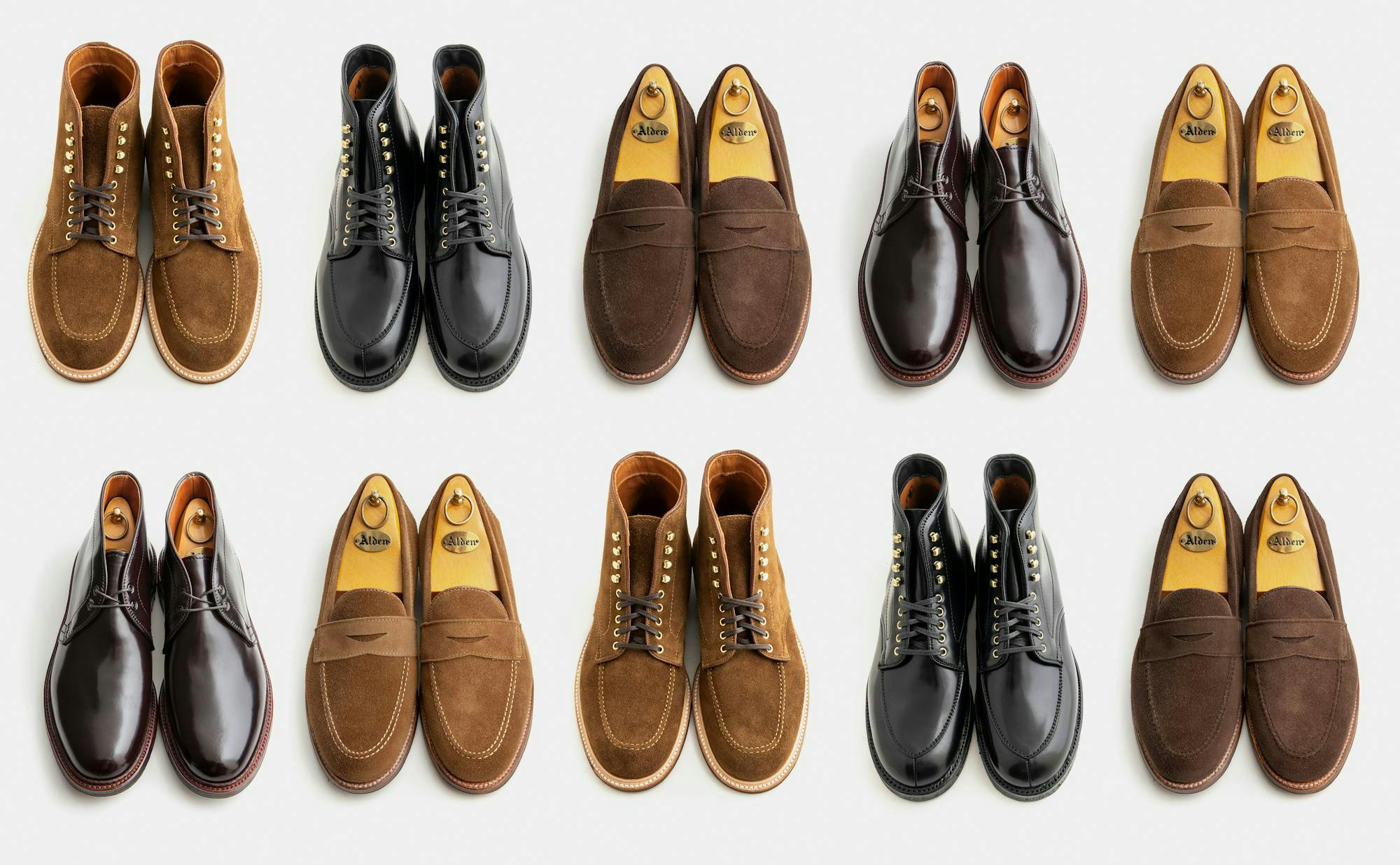Ten pairs of Alden shoes on a light grey background.